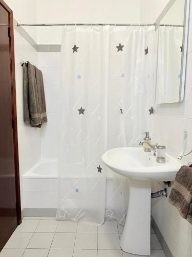 a bathroom with a shower curtain with stars on it at Beautiful Room in the montains in Estrela