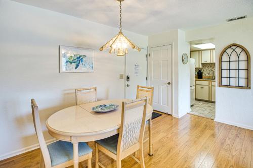 a dining room and kitchen with a table and chairs at Less Than half Mi to Coast New Smyrna Beach Getaway in New Smyrna Beach