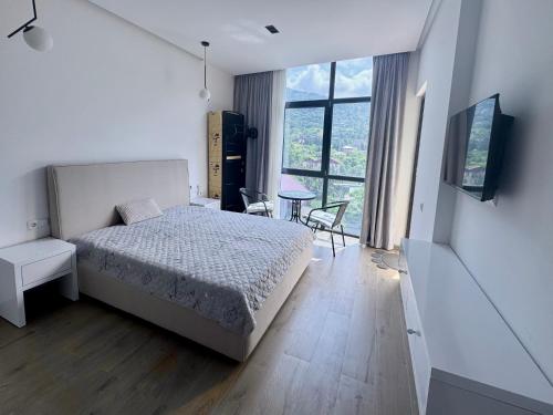 Postel nebo postele na pokoji v ubytování Gonio Studio in Batumi