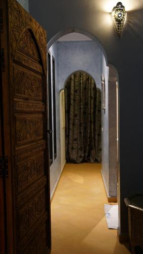 an entrance to a room with an archway and a door at Villa Zazate private pool & starry garden in Ouarzazate