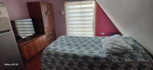 En eller flere senge i et værelse på Cabañas Mil Colores