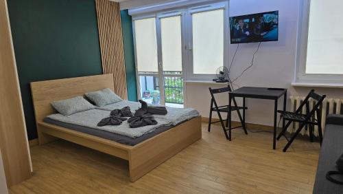 Ένα ή περισσότερα κρεβάτια σε δωμάτιο στο Apartament Kasia