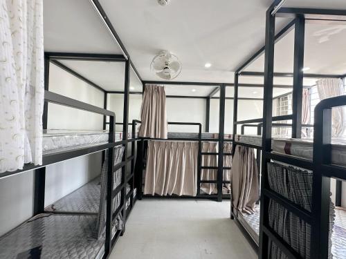 a room with three bunk beds in a room at Khách sạn Na Na Thiên Trà in Quận Ðăng (2)