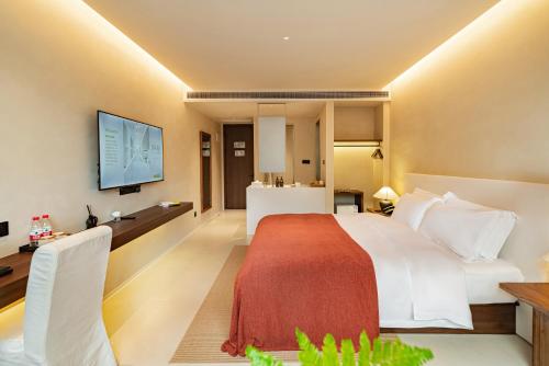 Letto o letti in una camera di Terra Art Garden Hotel