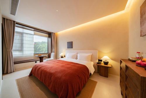Letto o letti in una camera di Terra Art Garden Hotel