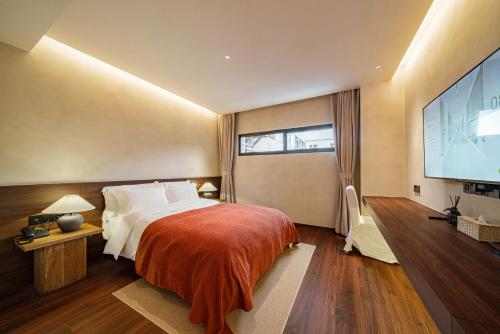 Letto o letti in una camera di Terra Art Garden Hotel