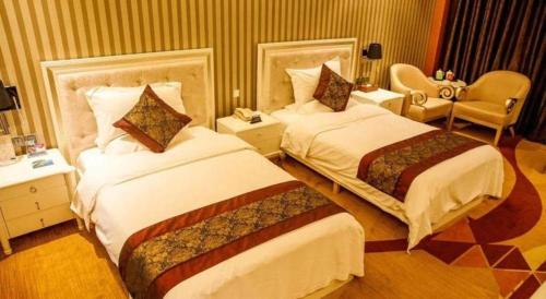Ένα ή περισσότερα κρεβάτια σε δωμάτιο στο Metropark Hotel