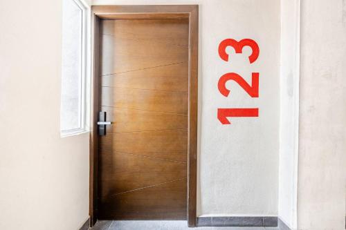 a wooden door with a sign on a wall at Apt in Nuevo Vallarta, 5 min from beach in Nuevo Vallarta 