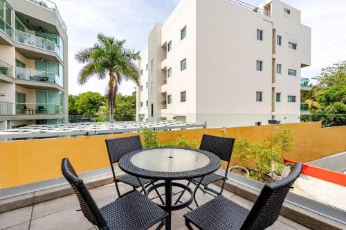 a patio with a table and chairs on a balcony at Apt in Nuevo Vallarta, 5 min from beach in Nuevo Vallarta 