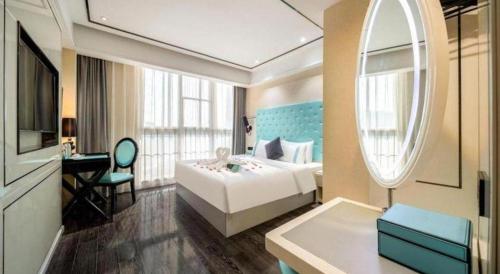 Ένα ή περισσότερα κρεβάτια σε δωμάτιο στο Xana Lite Neijiang Zizhong Shanghehui Branch