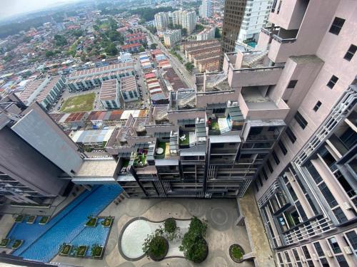 an overhead view of a building with a swimming pool at Imperio Residence Melaka by Jeffery Lam Home Management in Melaka
