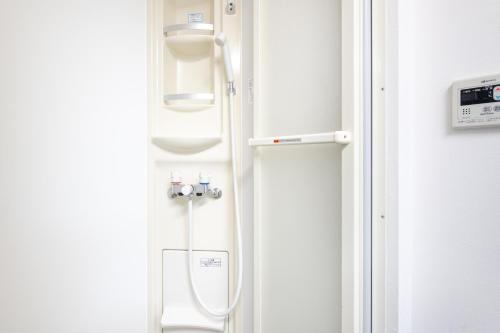 a bathroom with a white toilet in a room at 富久町 in Tokyo