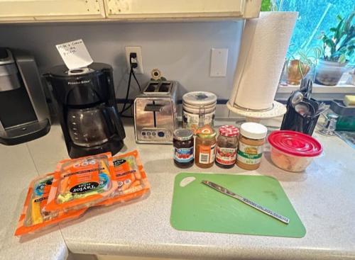 a counter top with a pen and other items on it at Cozy Nook in Fraser Valley Getaway With Breakfast in Abbotsford