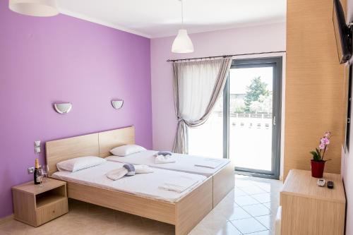 Postel nebo postele na pokoji v ubytování Golden Sun Villas