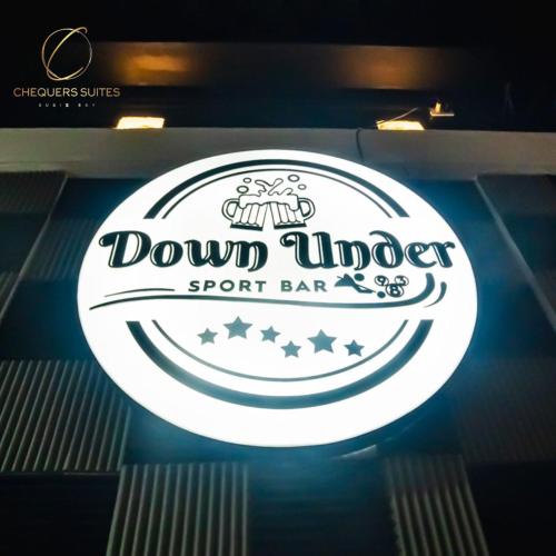 a sign for a sport bar in a restaurant at Chequers Suites Subic Bay in Olongapo