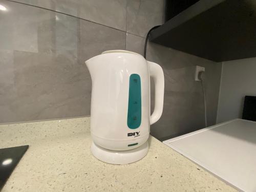 a white blender sitting on top of a counter at Imperio Residence Melaka by Jeffery Lam Home Management in Melaka