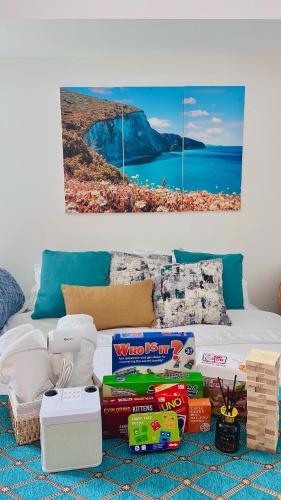 a living room with a bed with some toys on it at Kaiah's Haven at Azure North San Fernando Pampanga in San Fernando