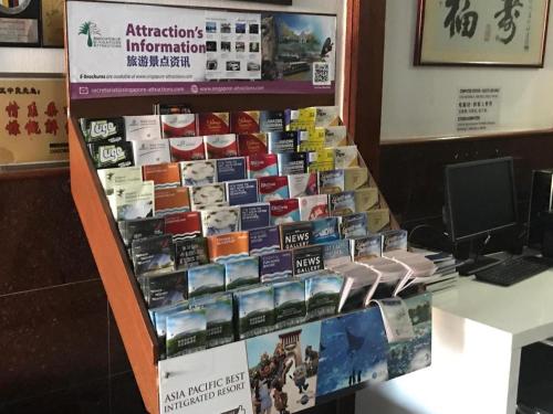 a display of books on a shelf in a store at Lai Ming Hotel Cosmoland in Singapore