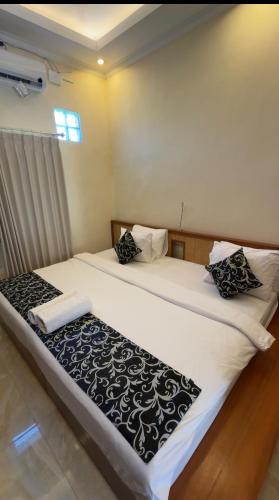 Ένα ή περισσότερα κρεβάτια σε δωμάτιο στο Ocho Bali Surf Camp