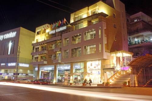 a building on a city street at night at Aley Suites in Aley