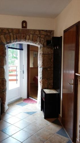 a room with a hallway with a door and a room with a door at Apartment Ilario in Cres