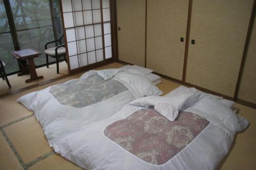 Postelja oz. postelje v sobi nastanitve Suehirokan