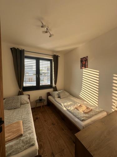 Postel nebo postele na pokoji v ubytování Apartmán Losonci