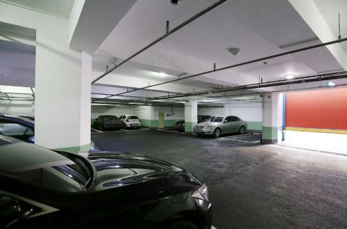 a parking garage with several cars parked in it at Daejeon Yongjeon I Hotel in Daejeon