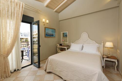 Ένα ή περισσότερα κρεβάτια σε δωμάτιο στο Ionia Suites