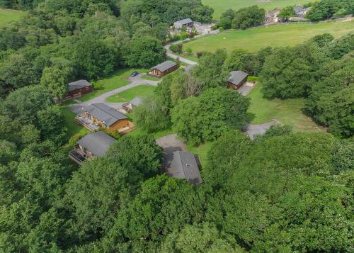 an aerial view of a house in the trees at Charlesworth Lodges in Glossop