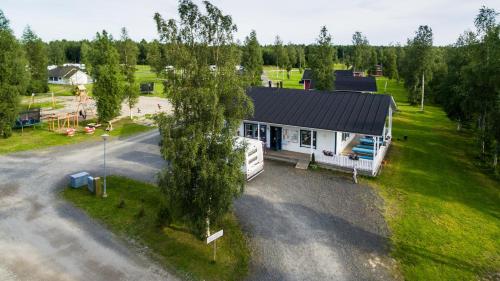 an aerial view of a house with a tree at Camping Tornio in Tornio
