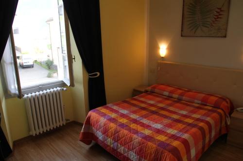Postel nebo postele na pokoji v ubytování Hotel Domodossola