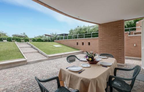 a patio with a table and chairs and a courtyard at Lovely Home In Velletri With Wifi in Velletri