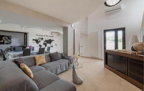 a living room with a couch and a tv at Lovely Home In Velletri With Wifi in Velletri