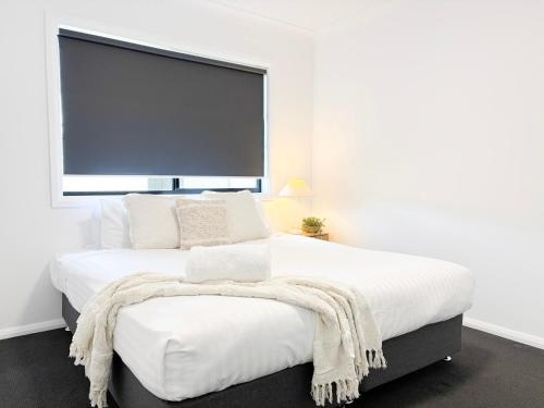 Ένα ή περισσότερα κρεβάτια σε δωμάτιο στο 19 Morris Crescent