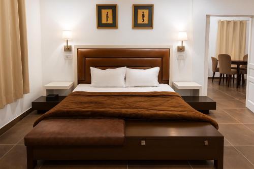 Giường trong phòng chung tại Hamton Villa Retreat