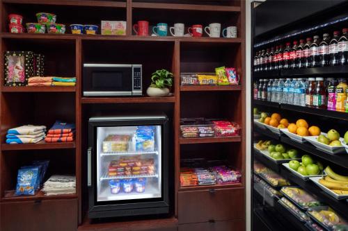 a refrigerator in a store filled with food and drinks at The Skirvin Hilton Oklahoma City in Oklahoma City