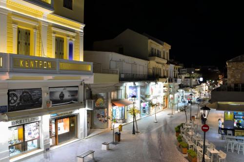 a city street at night with many shops at Elia Kentron in Chania Town
