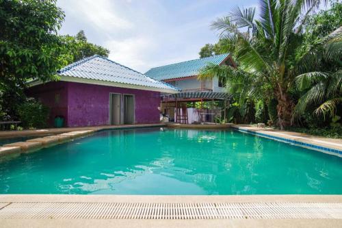 a swimming pool in front of a house at OYO 384 Ban Sabaidee in Phra Nakhon Si Ayutthaya