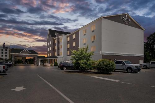 a hotel with a parking lot in front of it at Country Inn & Suites by Radisson, Princeton, WV in Princeton