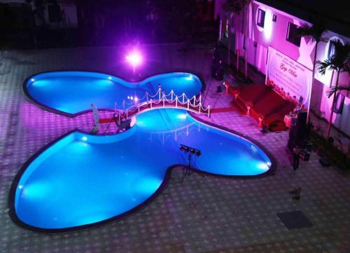 an overhead view of a swimming pool at night at Green Hotel Da Nang in Da Nang