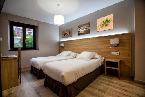 Una cama o camas en una habitación de Hotel Meve