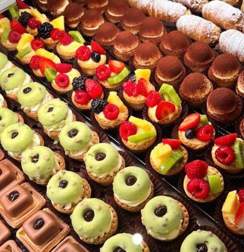 a display of pastries and cakes and other desserts at Pie Castello in Susegana