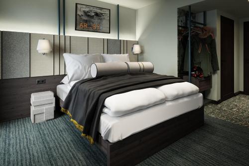 a bedroom with a large bed with white pillows at Gausta Sportell in Gaustablikk