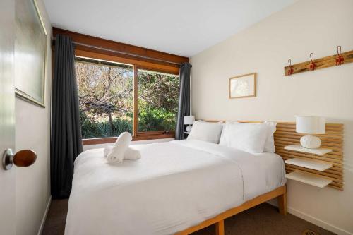 En eller flere senge i et værelse på Blue Mist Hideaway