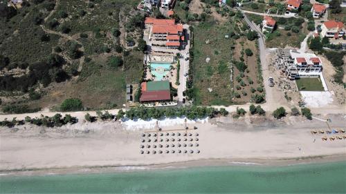 an aerial view of a resort on a beach at Grand Beach Hotel Thassos in Limenaria
