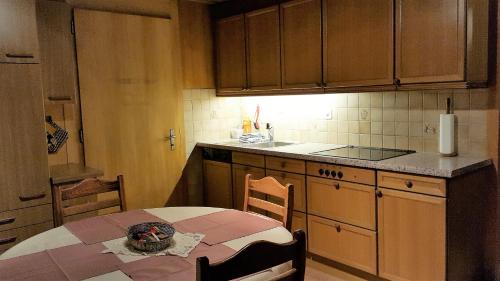 a kitchen with a table with a skull on it at Chalet Spillstatt in Grindelwald