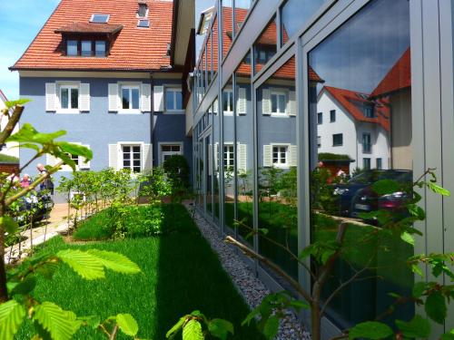 an external view of a building with green grass at DIE KRONE - Hotel Garni in Kirchzarten
