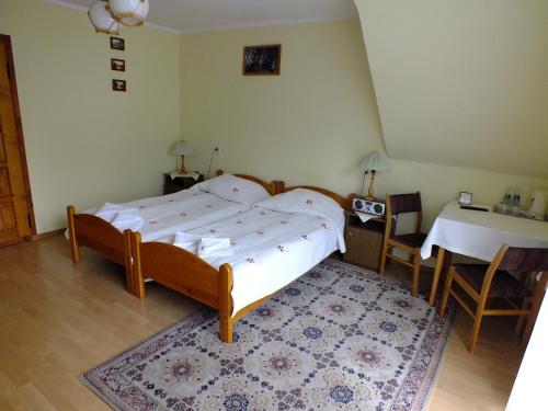 מיטה או מיטות בחדר ב-Willa Anna Maria