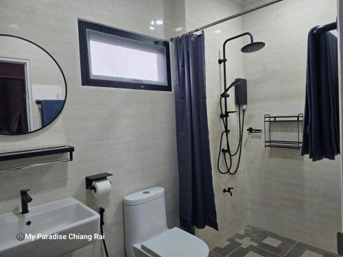 a bathroom with a shower and a toilet and a sink at My Paradise Chiang Rai in Ban Doi Hang